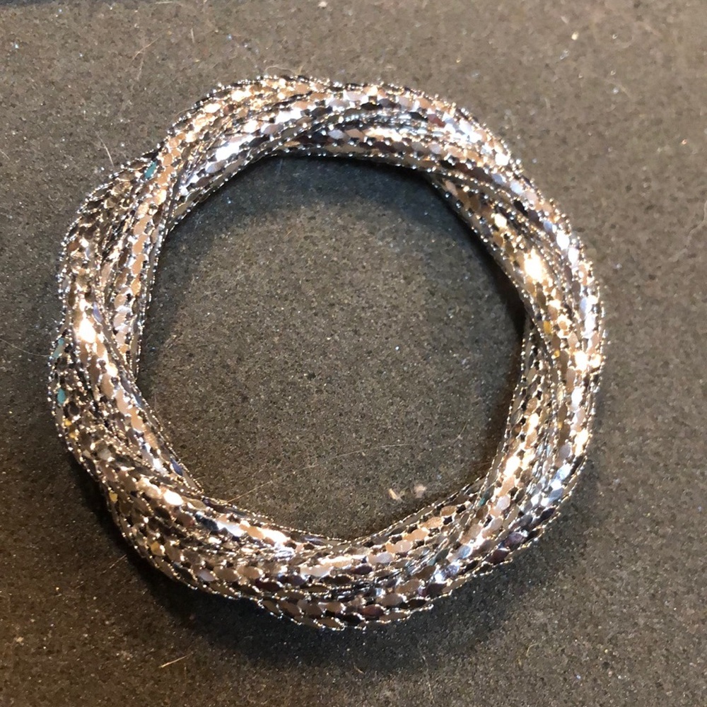 Unique silver tone twist bracelet